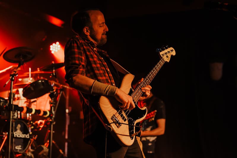 Full band panoramic shot with dramatic lighting