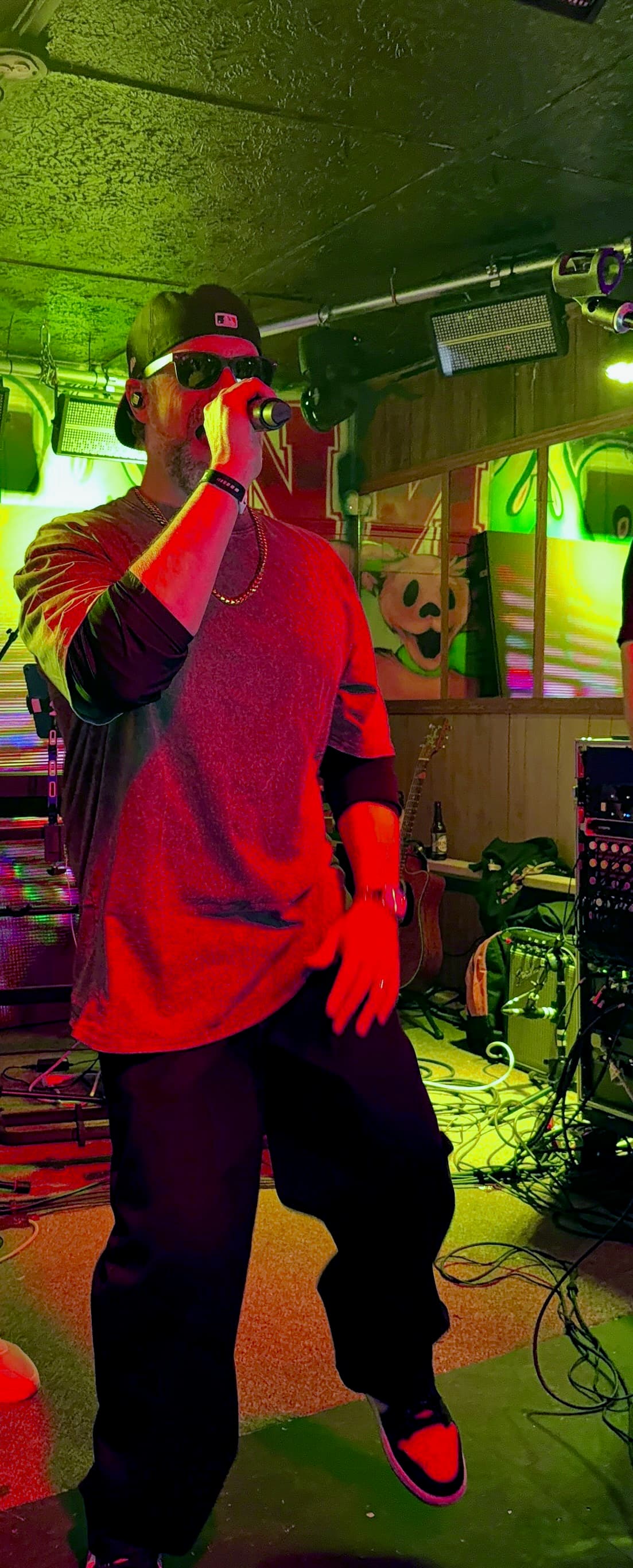 Keyboardist spotlit during a soulful breakdown