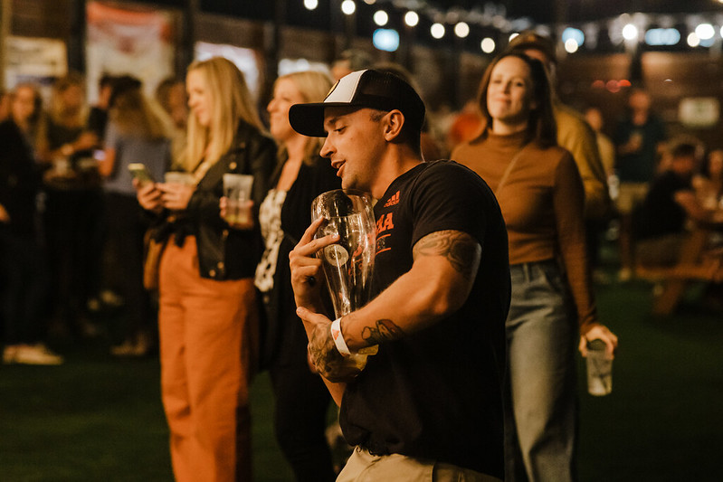 Wide-angle shot of the stage with the full band performing