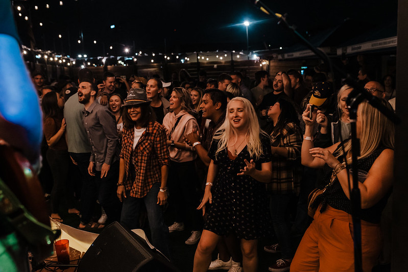 Band members sharing the spotlight during a big chorus