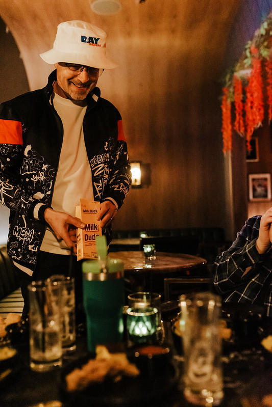 Guitarist silhouetted by blue and pink stage lights