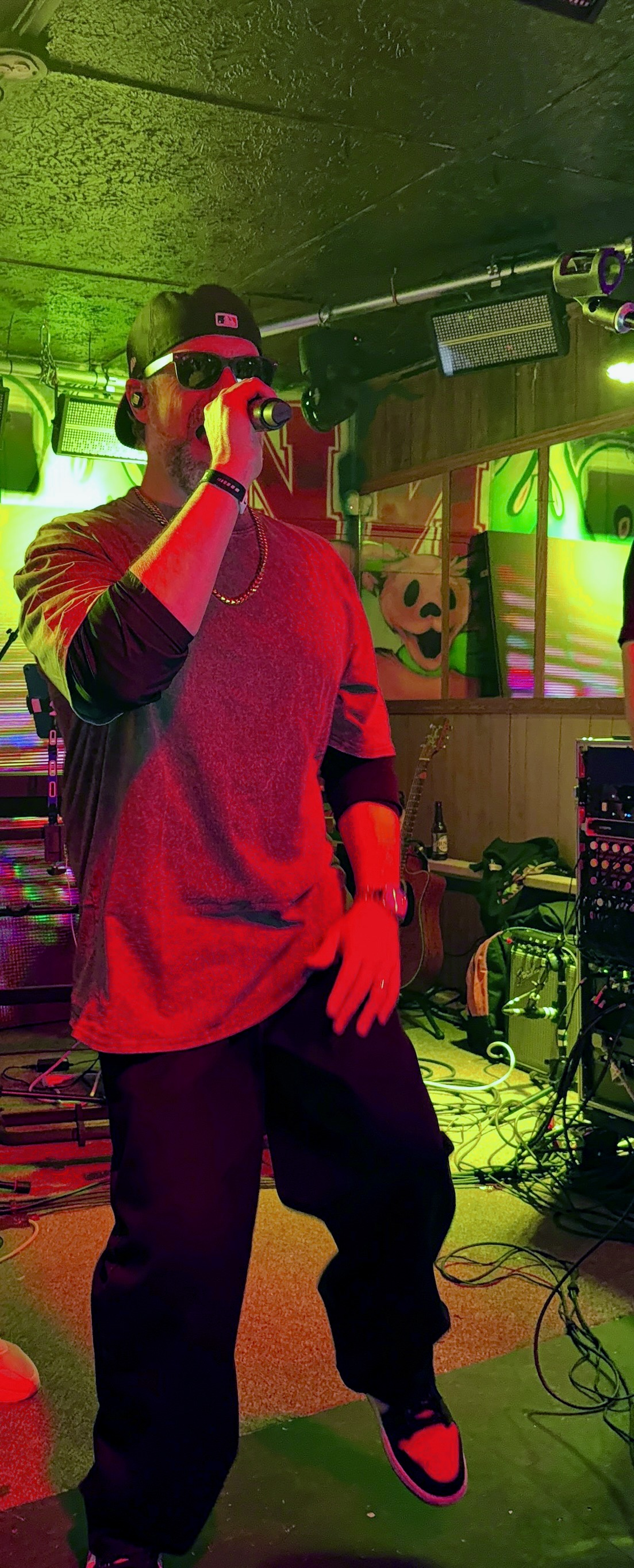 Keyboardist spotlit during a soulful breakdown