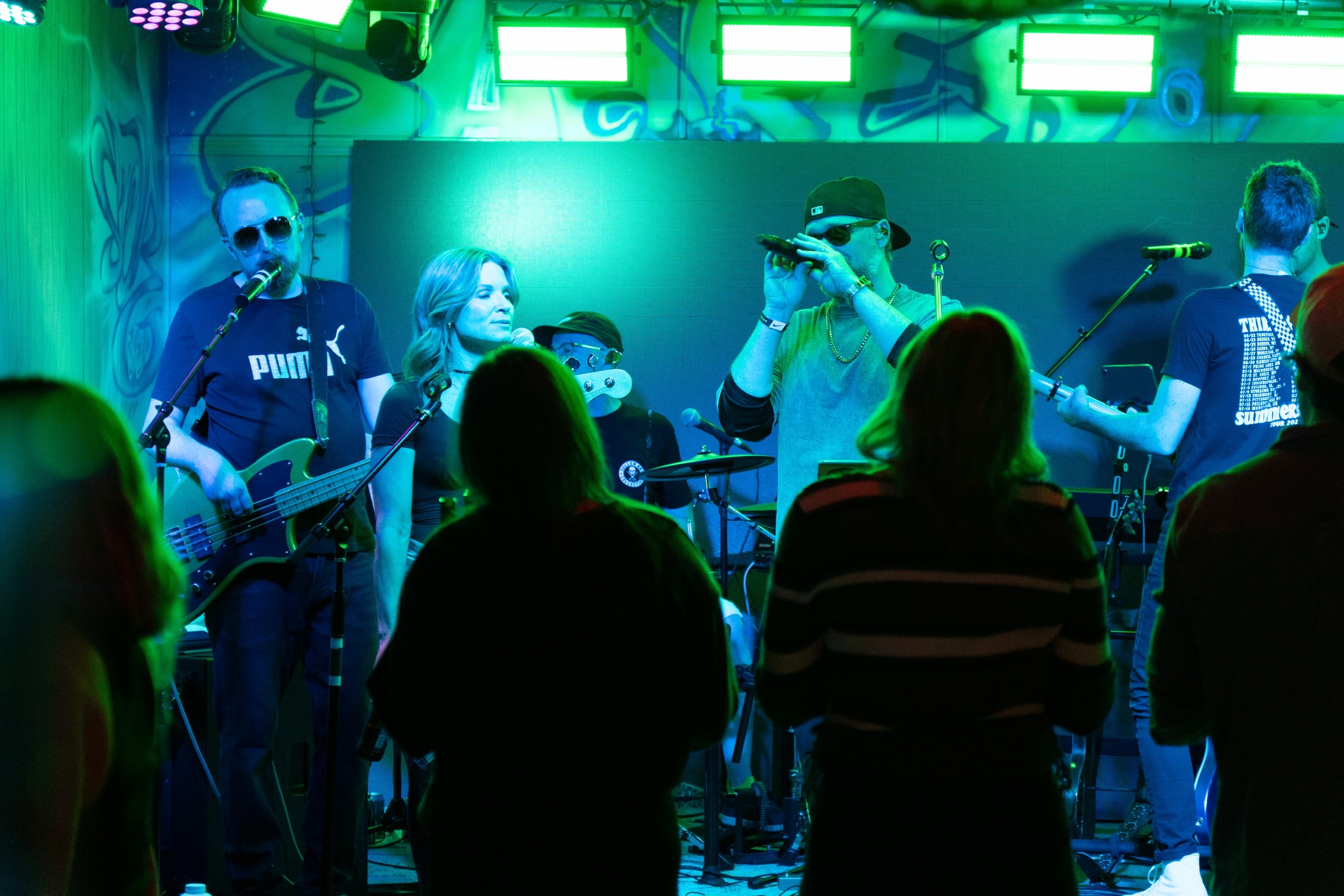 Wide shot of the band performing at an outdoor festival