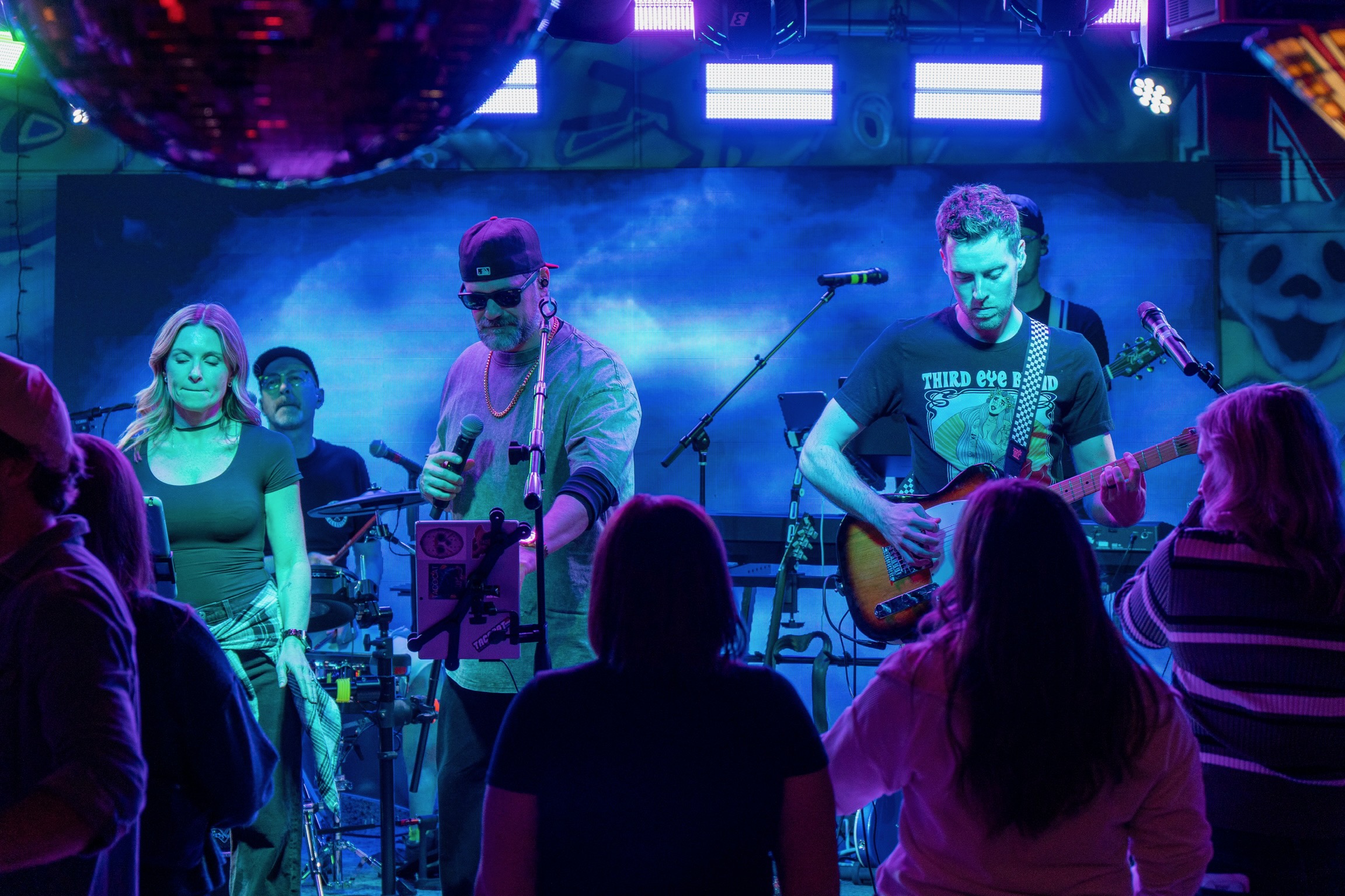Band members sharing a moment on stage between songs